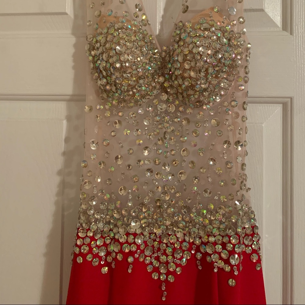 Red dress with mesh with faux diamonds bustled